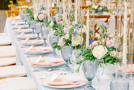 A long table set with dishes and cutlery